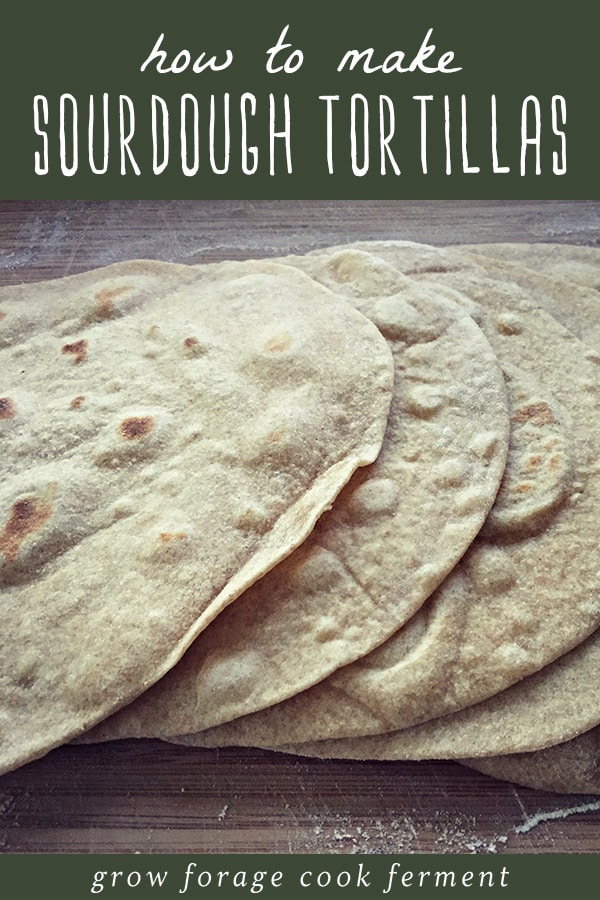 Homemade sourdough tortillas on a cutting board.