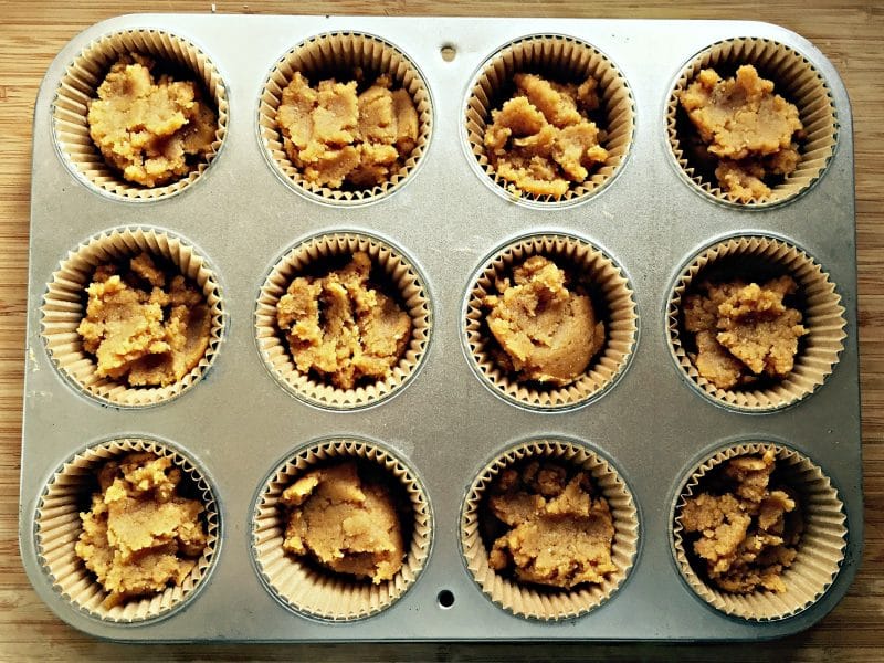 pumpkin coconut mixture in a muffin tin