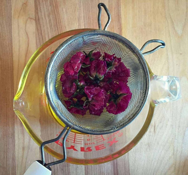 straining rose infused oil