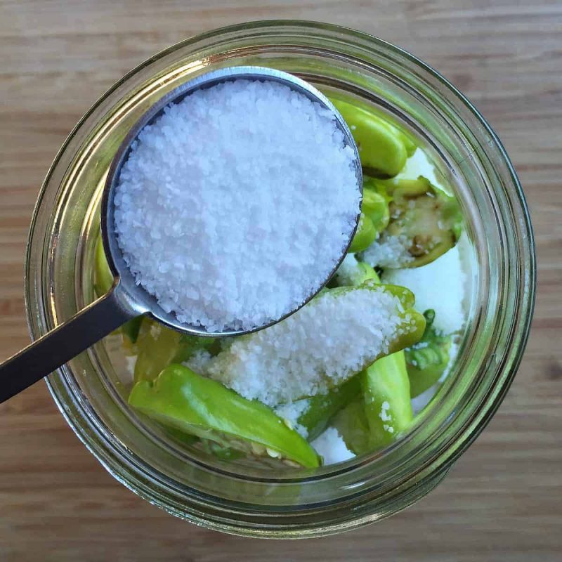 salting the pepperoncini peppers