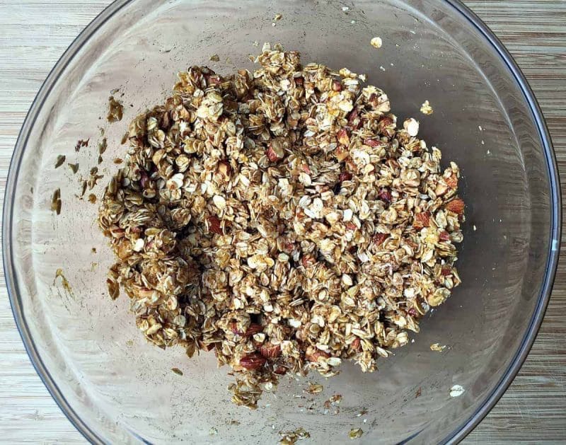 bowl of unbaked pumpkin coconut almond granola