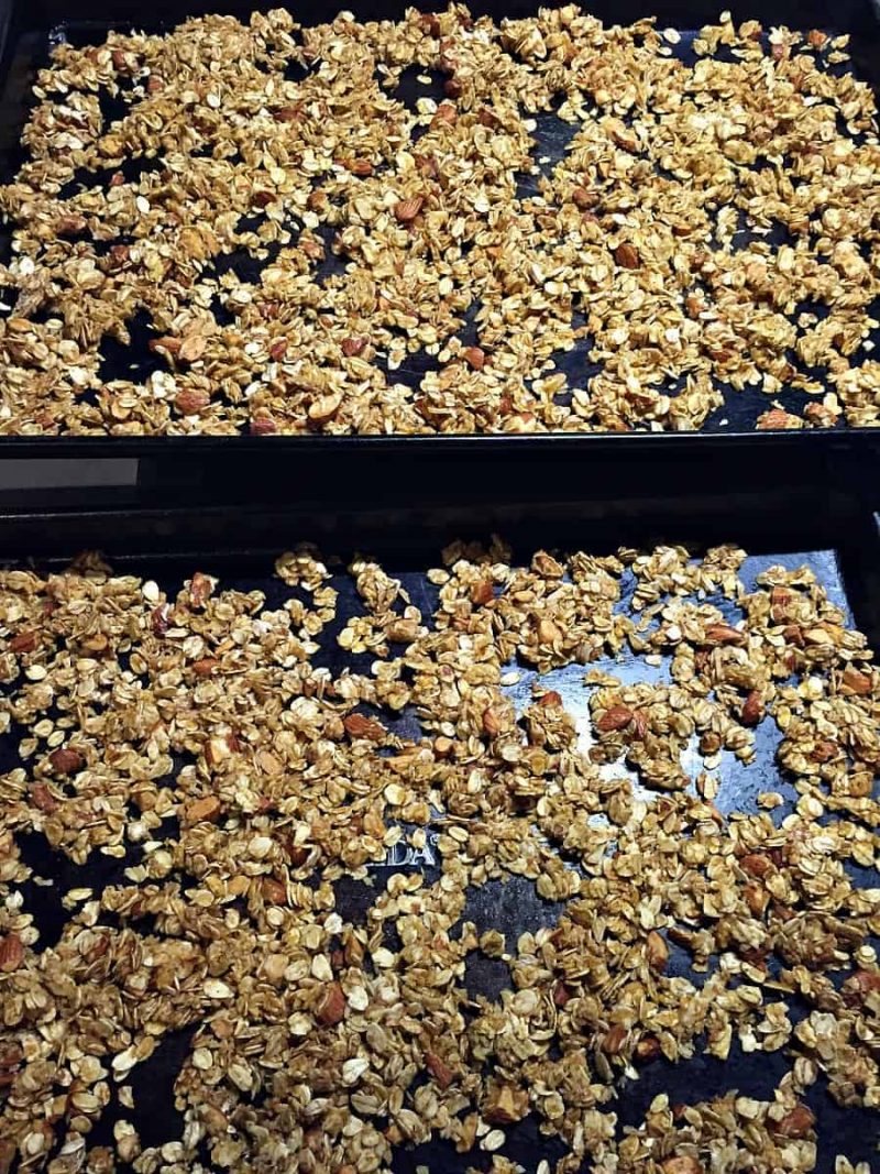 two sheet pans with baked pumpkin granola
