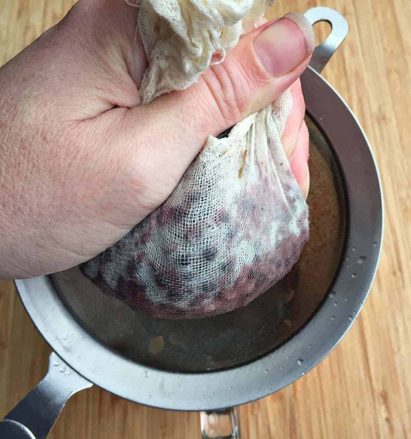 squeezing-out-elderberry-tincture