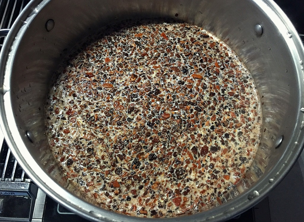 boiling the roots and herbs to make homemade root beer