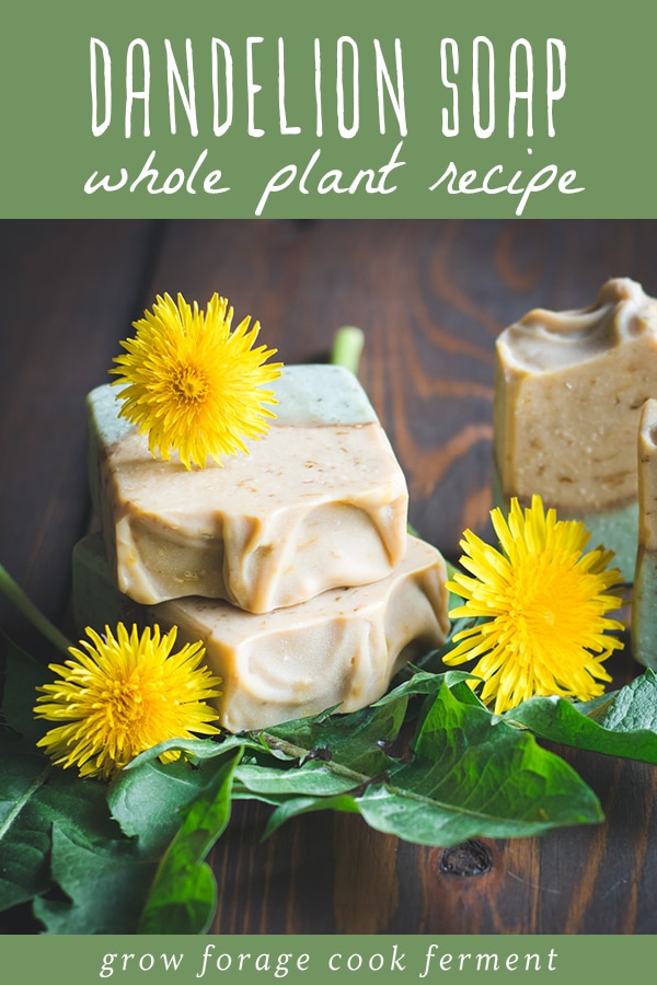 dandelion soap on a wooden table with dandelion blossoms and leaves