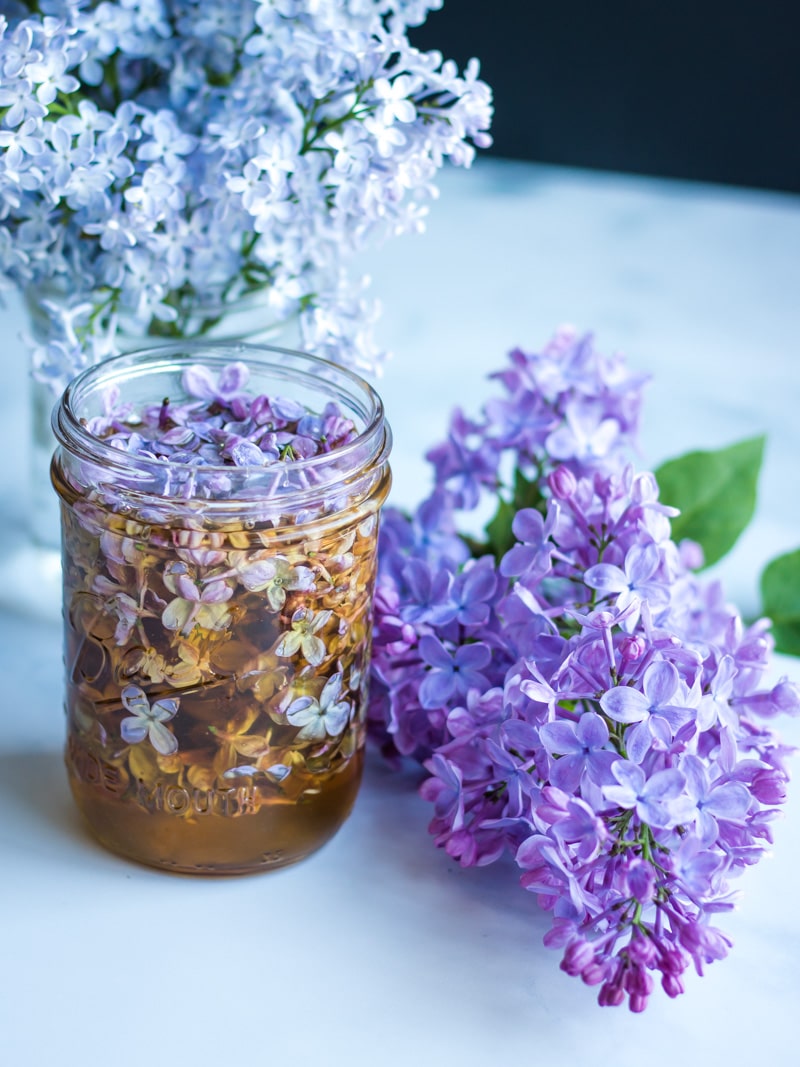 lilac flower infused honey in a jar