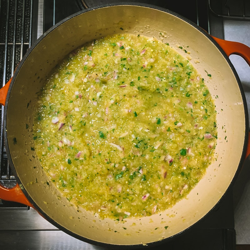 making green tomato salsa verde in a pot