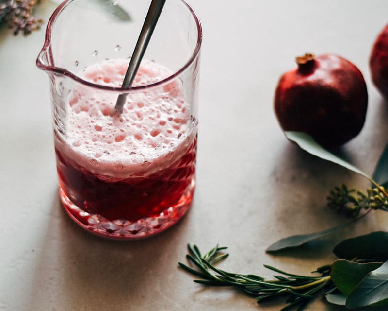 fresh pomegranate juice in a glass pitcher