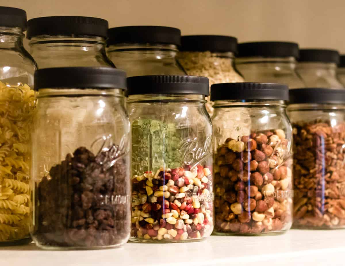 ball jars lined up in a pantry