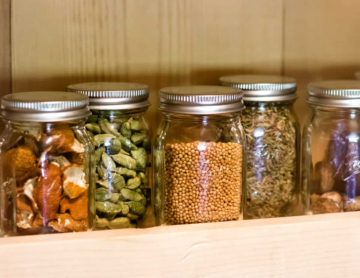 ball mini jars in a spice rack