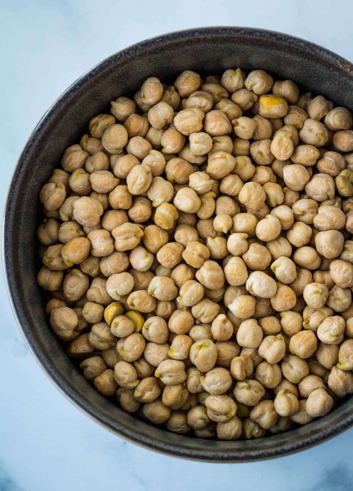 a bowl of dried garbonzo beans, also known as chickpeas