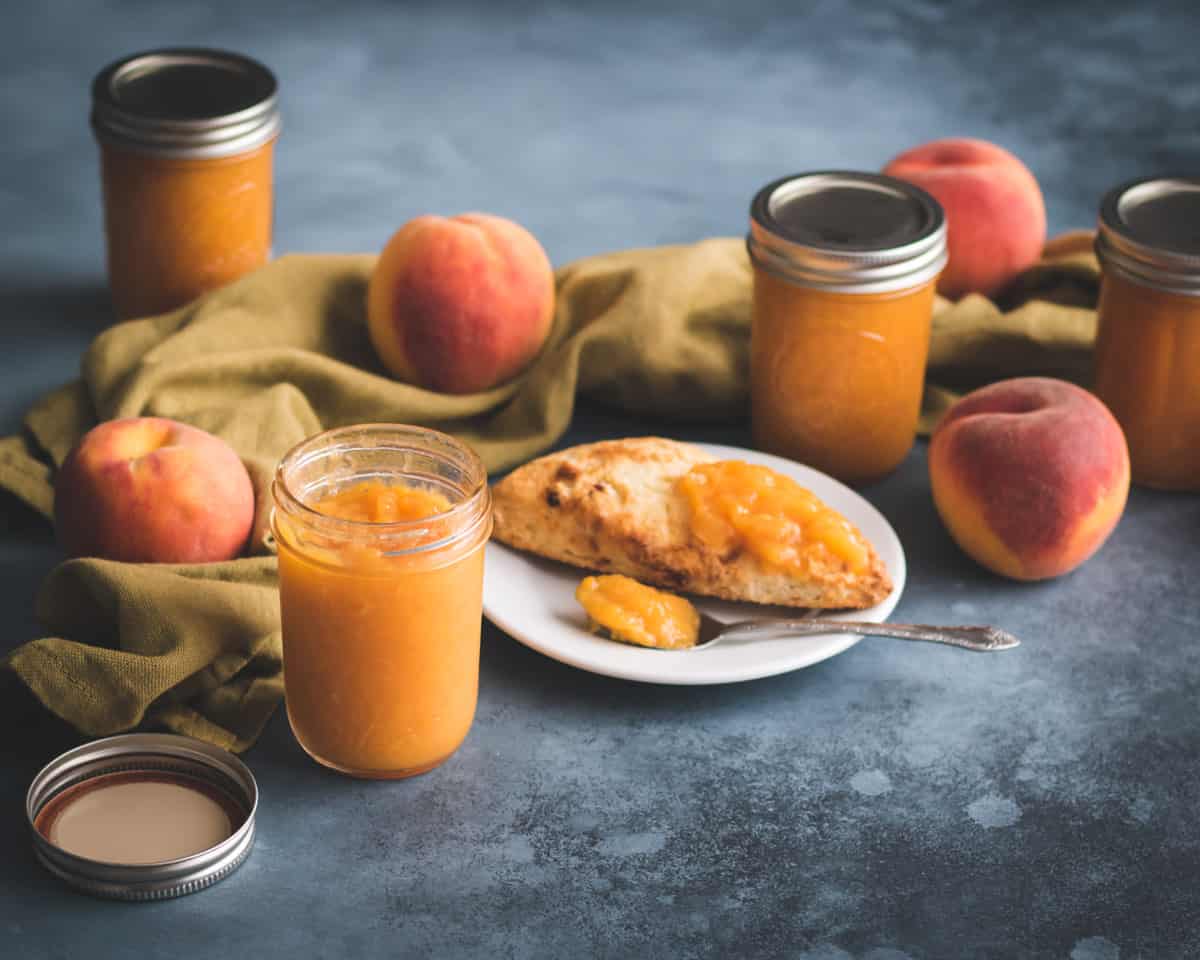 no sugar peach jam with peaches and a scone