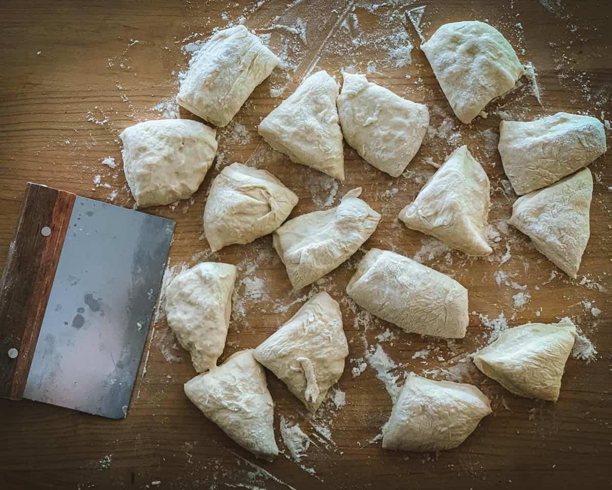 cutting the mini sourdough doughs into small pieces 