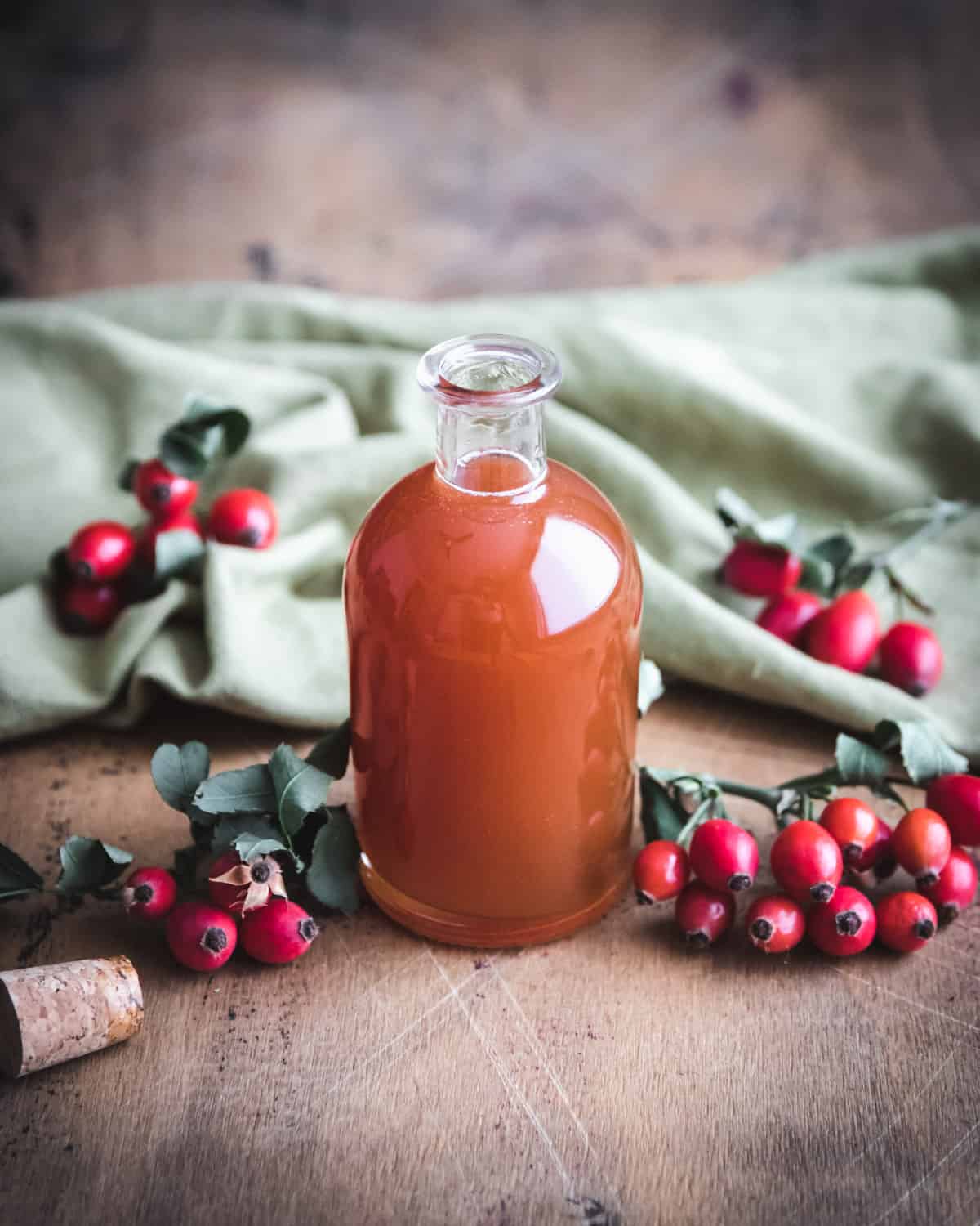 a bottle of rose hip syrup on a table