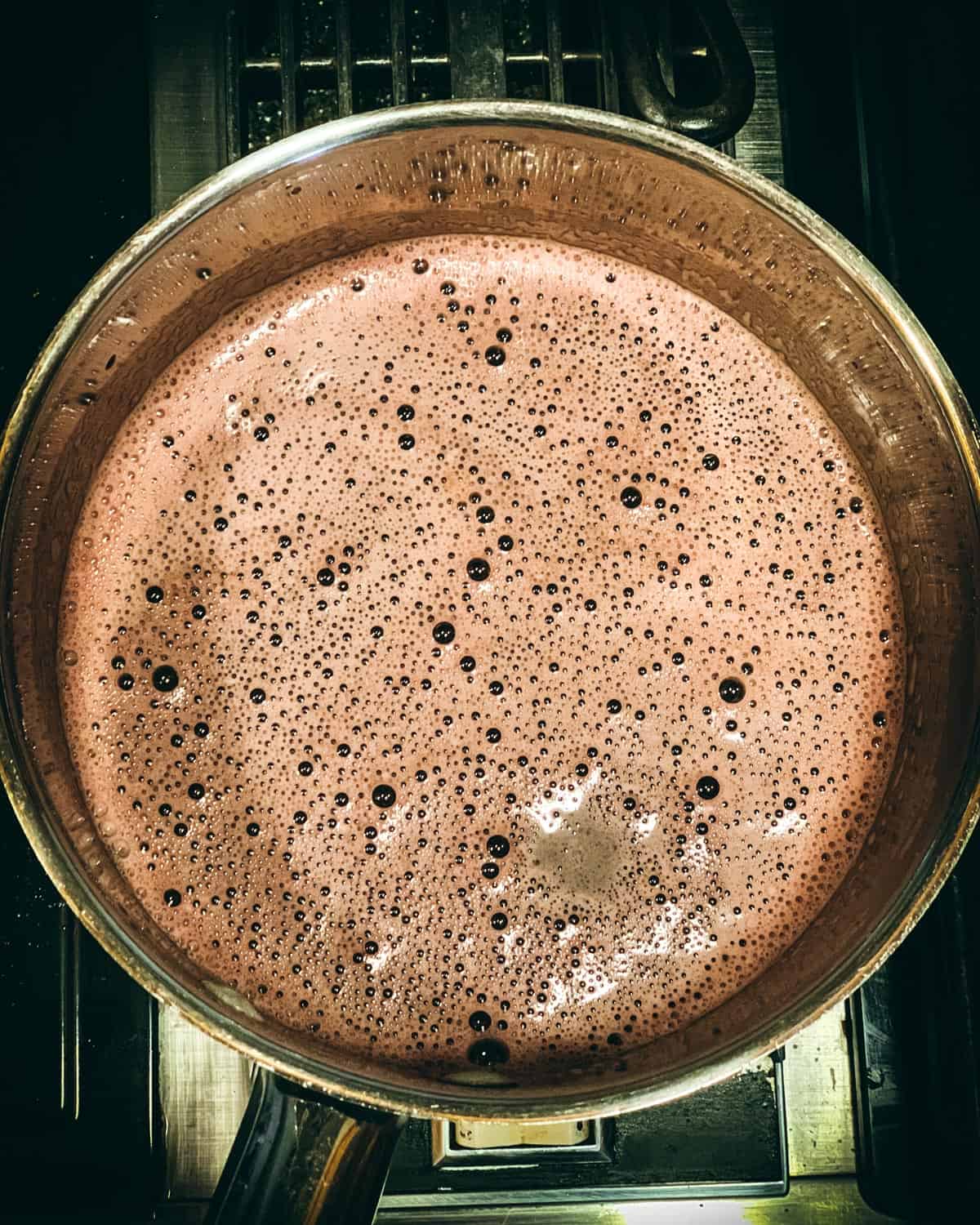 a pot with the finished elderberry gummy mixture