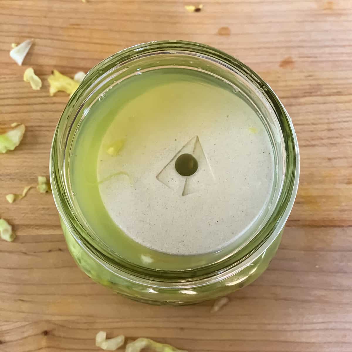 a ceramic fermenting weight on top of the cabbage