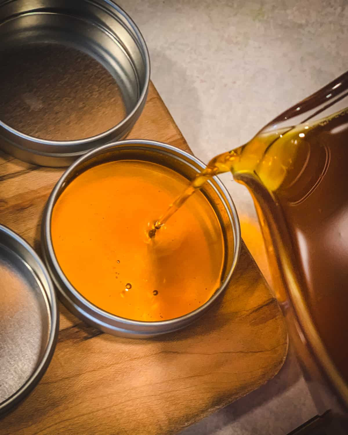 pouring the salve mixture into a tin